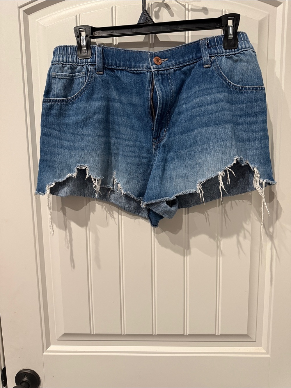 High-Rise Distressed Denim Shorts in Blue